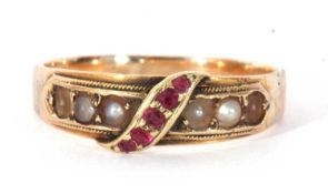 Victorian 15ct gold ruby and seed pearl ring, the centre applied with a band of graduated rubies