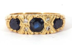 18ct gold sapphire and diamond ring featuring three graduated round cut sapphires, highlighted