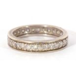 Precious metal and diamond eternity ring, a full band of small single cut diamonds, size K/L