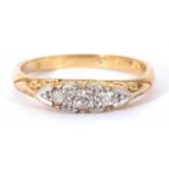 Three stone diamond ring of boat shape featuring three small graduated diamonds in illusion