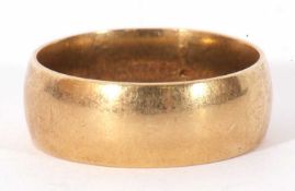 18ct gold wedding ring, the wide band of plain polished design, 10.7gms, size U/V