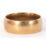 18ct gold wedding ring, the wide band of plain polished design, 10.7gms, size U/V