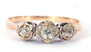 Three stone diamond ring featuring three small graduated old cut diamonds, all in illusion settings,