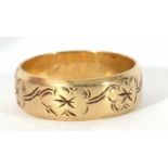 14ct gold stamped wedding ring, the band with a floral engraved design, 6.7gms, size R/S