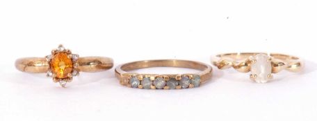 Three modern 9ct gold dress rings, coloured stone set, g/w 5.7gms