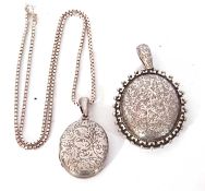 925 chain supporting an oval white metal locket together with a white metal large locket engraved