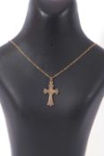 9ct stamped cross pendant suspended from a 375 stamped chain, g/w 2.6gms