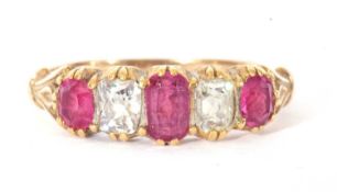 Ruby and diamond five stone ring alternate set with three graduated oval cut rubies and two old