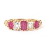 Ruby and diamond five stone ring alternate set with three graduated oval cut rubies and two old