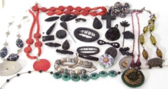 Large box of costume jewellery to include brooches, stick pins, necklaces etc