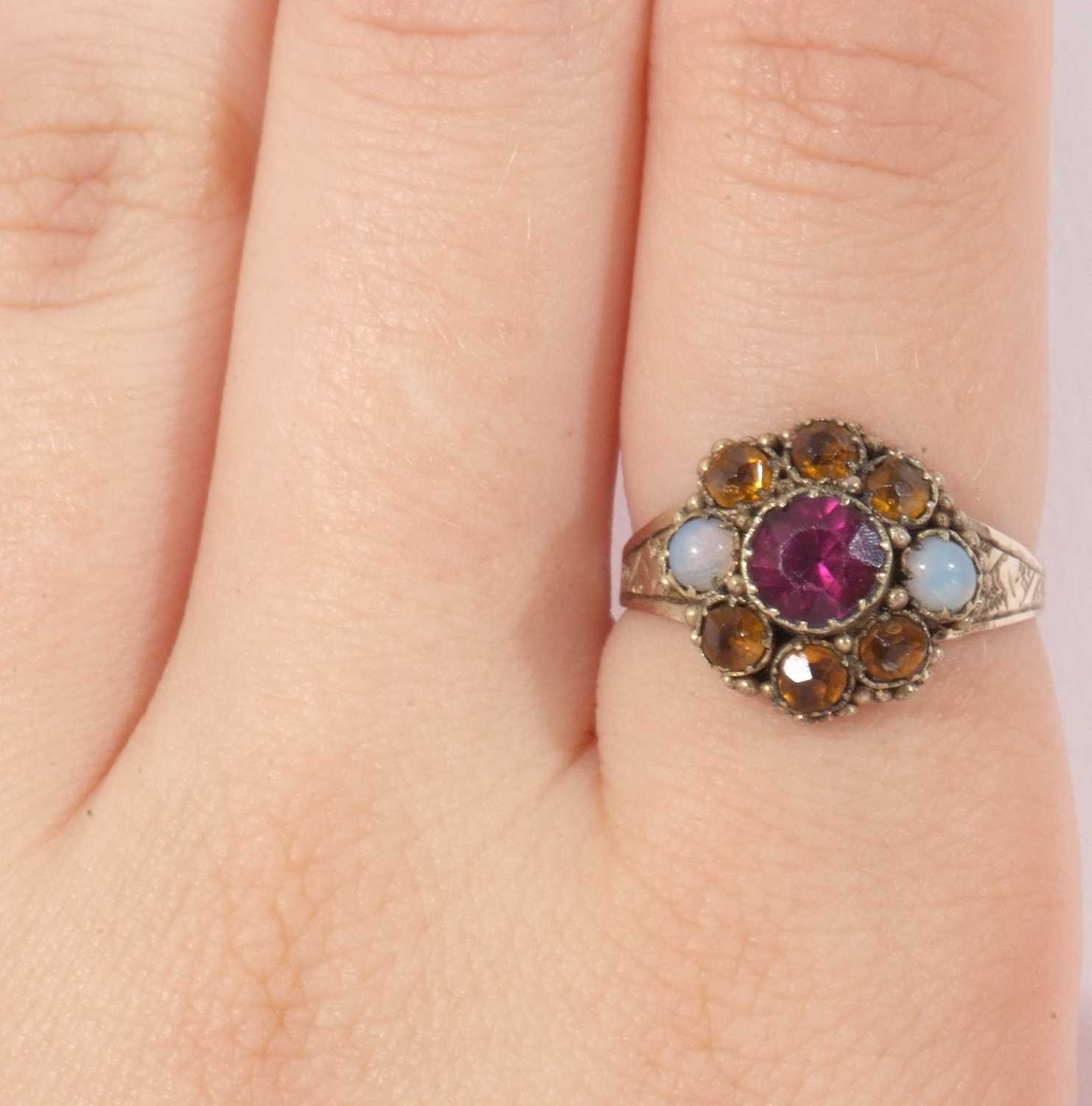Antique cluster ring set with two small opals. orange and pink stones, raised between engraved - Image 8 of 8