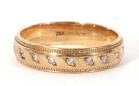 Modern 9ct gold and small diamond band, the top section set with six small single cut diamonds and