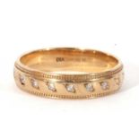 Modern 9ct gold and small diamond band, the top section set with six small single cut diamonds and