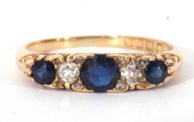 Antique 18ct gold sapphire and diamond ring featuring three graduated round cut sapphires and two