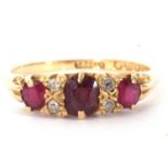 Victorian ruby and diamond ring featuring three graduated oval cushion cut rubies, highlighted