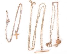 Group of three 9K marked trace chains, suspending a cross, heart and T-bar pendants. gross weight