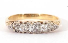 Five stone diamond ring of boat shape featuring five graduated old cut diamonds, individually claw