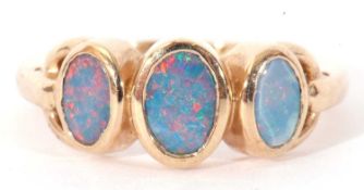 Modern 9ct gold and opalescent three stone ring featuring three graduated bezel set flat cut