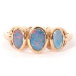 Modern 9ct gold and opalescent three stone ring featuring three graduated bezel set flat cut