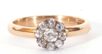 Old cut diamond cluster ring, a flowerhead design featuring nine graduated diamonds, the principal