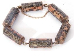 Vintage agate bracelet comprising six cylindrical faceted links joined by chain connectors and