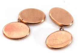 Pair of 9ct gold cuff links of oval shape, plain polished design with chain connectors, Birmingham