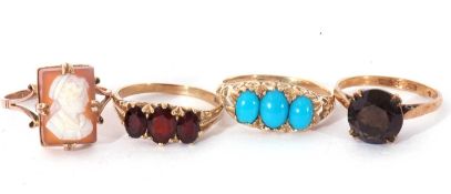 Four 9ct gold rings to include a cameo ring, a three stone garnet ring, a three stone turquoise