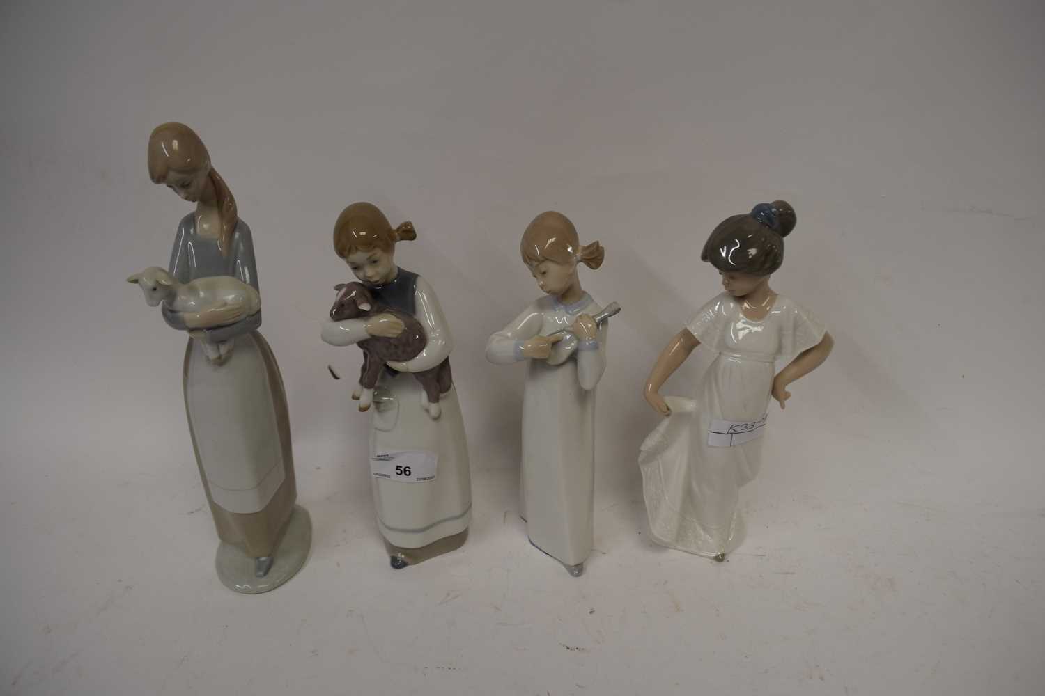 THREE VARIOUS LLADRO FIGURES TOGETHER WITH A FURTHER NAO FIGURE (4)