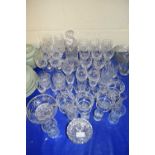 LARGE QUANTITY OF 20TH CENTURY CUT GLASS DRINKING GLASSES, DECANTERS ETC
