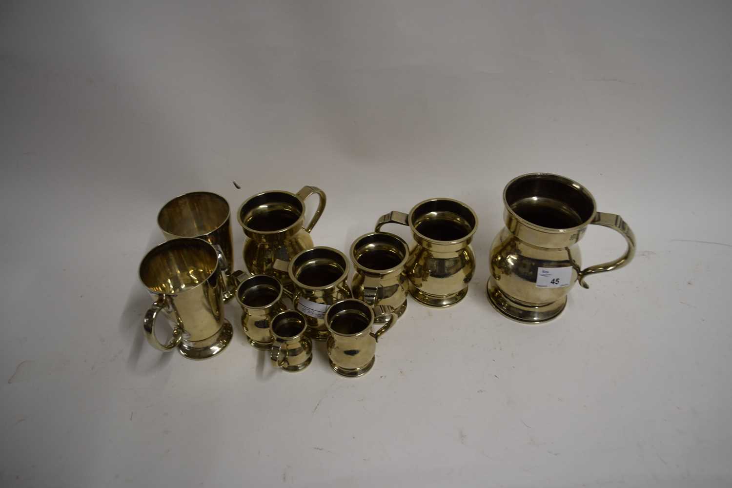 GRADUATED SET OF SILVER PLATED VICTORIAN MEASURES FROM HALF GILL TO PINT TOGETHER WITH TWO FURTHER