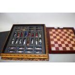 MODERN LACQUERED CHESS BOARD WITH COLLECTION OF RESIN FIGURES