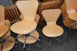 THREE MODERN PLYWOOD AND CHROME FRAMED REVOLVING CHAIRS