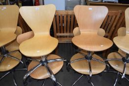 FOUR MODERN PLYWOOD AND CHROME FRAMED REVOLVING CHAIRS