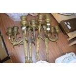 FOUR CLASSICALLY STYLED METAL DOUBLE LIGHT WALL SCONCES