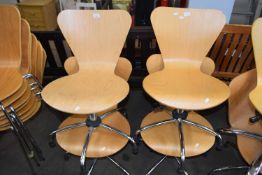 FOUR MODERN PLYWOOD AND CHROME FRAMED REVOLVING CHAIRS