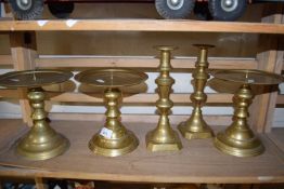 SET OF THREE REPRODUCTION BRASS PRICKET STYLE CANDLESTICKS PLUS A FURTHER PAIR OF BRASS CANDLESTICKS
