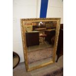 A MODERN RETANGULAR BEVELED WALL MIRROR IN GILT FINISH FRAME