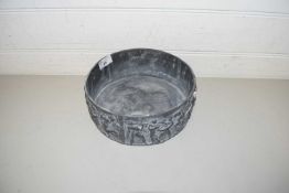 A SHALLOW CIRCULAR LEAD BOWL DECORATED WITH A CONTINUOUS BAND OF CLASSICAL FIGURES 22 CM DIAMETER