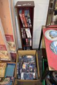 QUANTITY OF ASSORTED STAR TREK AND OTHER VIDEOS PLUS A SMALL SHELF UNIT