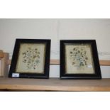 PAIR OF SMALL 19TH CENTURY NEEDLEWORK PICTURES OF FLOWERS SET IN EBONISED FRAMES