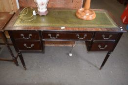 REPRODUCTION MAHOGANY VENEERED AND LEATHER TOP FIVE DRAWER DESK