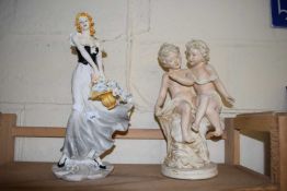 MODERN RESIN FIGURE OF A LADY WITH BASKET OF FLOWERS TOGETHER WITH A FURTHER RESIN FIGURE GROUP OF 2