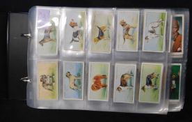 Modern cigarette card album containing 14 full sets of cigarette cards including Gallaher 1935