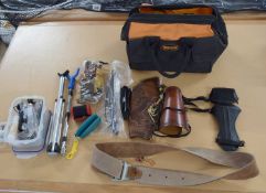 A bag of archery/bow hunting-related items, including: bowstrings, bracers and finger tabs etc.