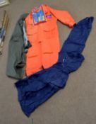 A modern orange ‘freedom offshore’ floatation suit for offshore fishing, together with 2 pairs of