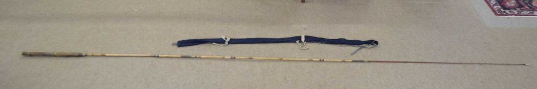 A very good quality 20th century 3-part bamboo fly fishing rod with cork grip handle, brass