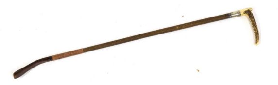 Leather bound riding crop with deer antler handle and silver band
