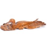 "pintail on the water" carved wood by colin May from a single piece of wood. purchased from the