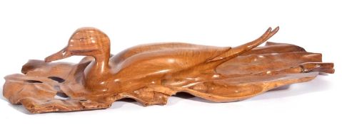 "pintail on the water" carved wood by colin May from a single piece of wood. purchased from the
