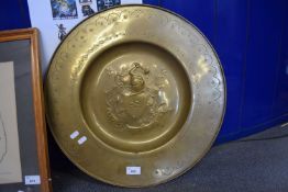 CIRCULAR BRASS ALMS TYPE CHARGER WITH HERALDIC DETAIL TO CENTRE